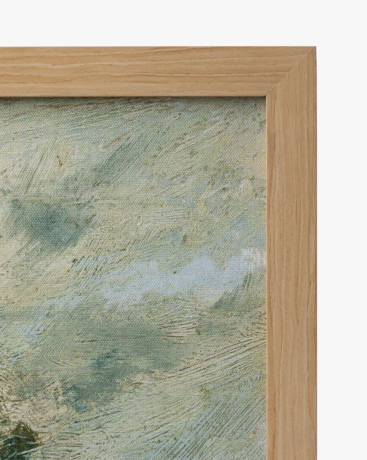 Close-up of the top right corner of a natural oak frame with textured canvas inside, featuring English Meadows—an abstract blue, white, and green countryside landscape giclee by McGee & Co.