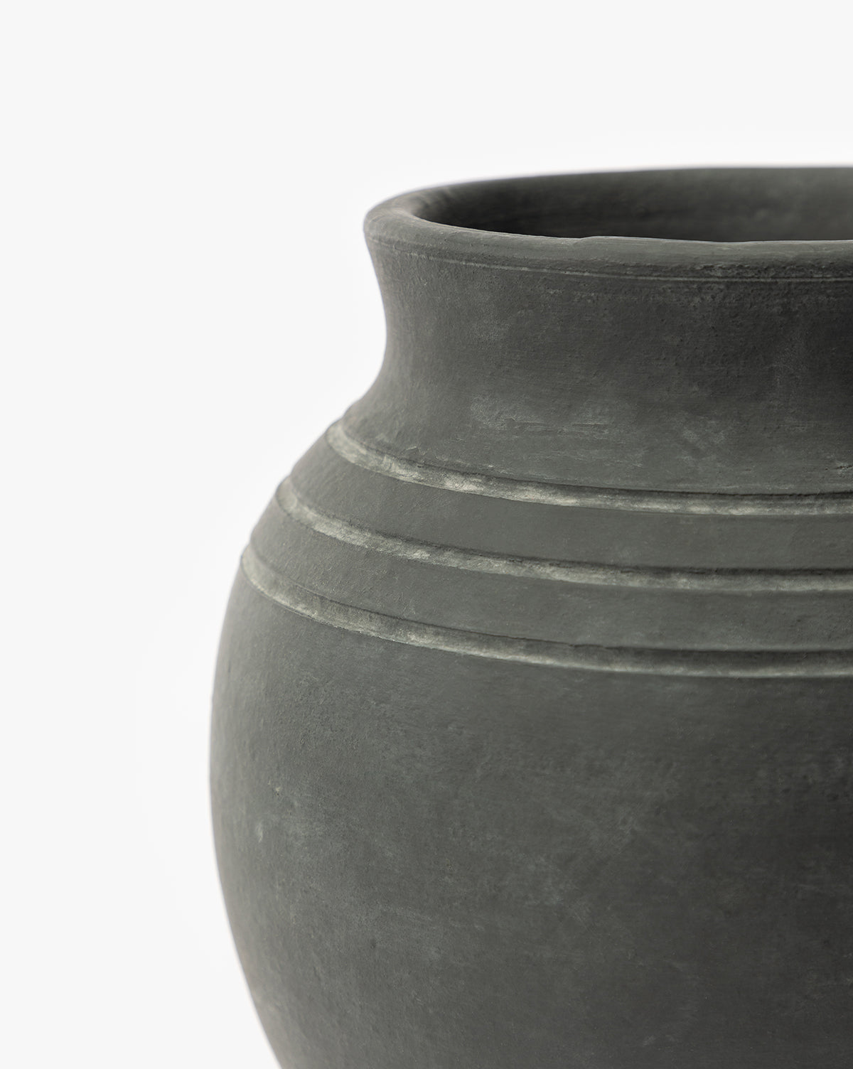 Close-up of the upper half of the Ethel Vase, a dark gray matte black terracotta piece with a smooth finish and three horizontal lines near the rim, ideal for rustic home decor, set against a plain white background, by McGee & Co.