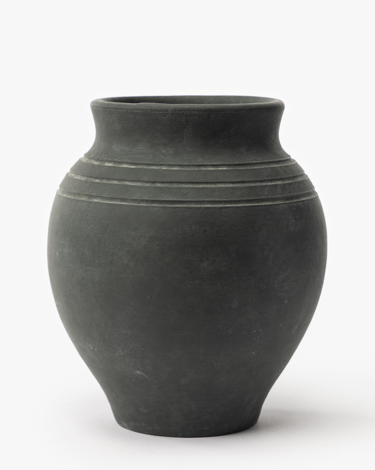 The Ethel Vase is a matte black terracotta piece with a rounded body, slightly narrow neck, and three horizontal lines on the upper section—perfect for rustic home decor and photographed against a plain white background, by McGee & Co.