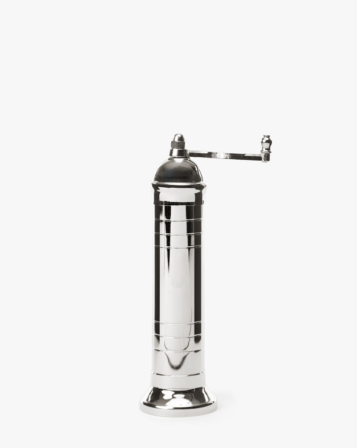 The European Chrome Salt Mill is a tall, shiny silver mill with a hand crank on top and an adjustable steel grinding mechanism, shown standing upright against a plain white background by McGee & Co.
