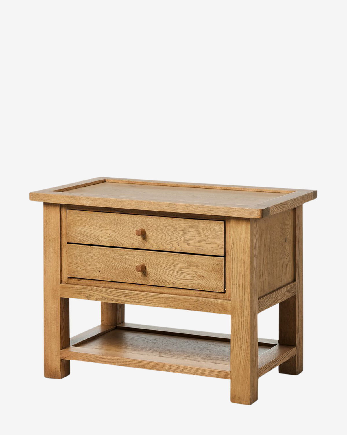 A rectangular coffee table with two drawers, round wooden knobs, an open lower shelf, and a light oak veneer. Its natural finish complements bedroom decor or pairs perfectly with the Faelan Nightstand, by McGee & Co.