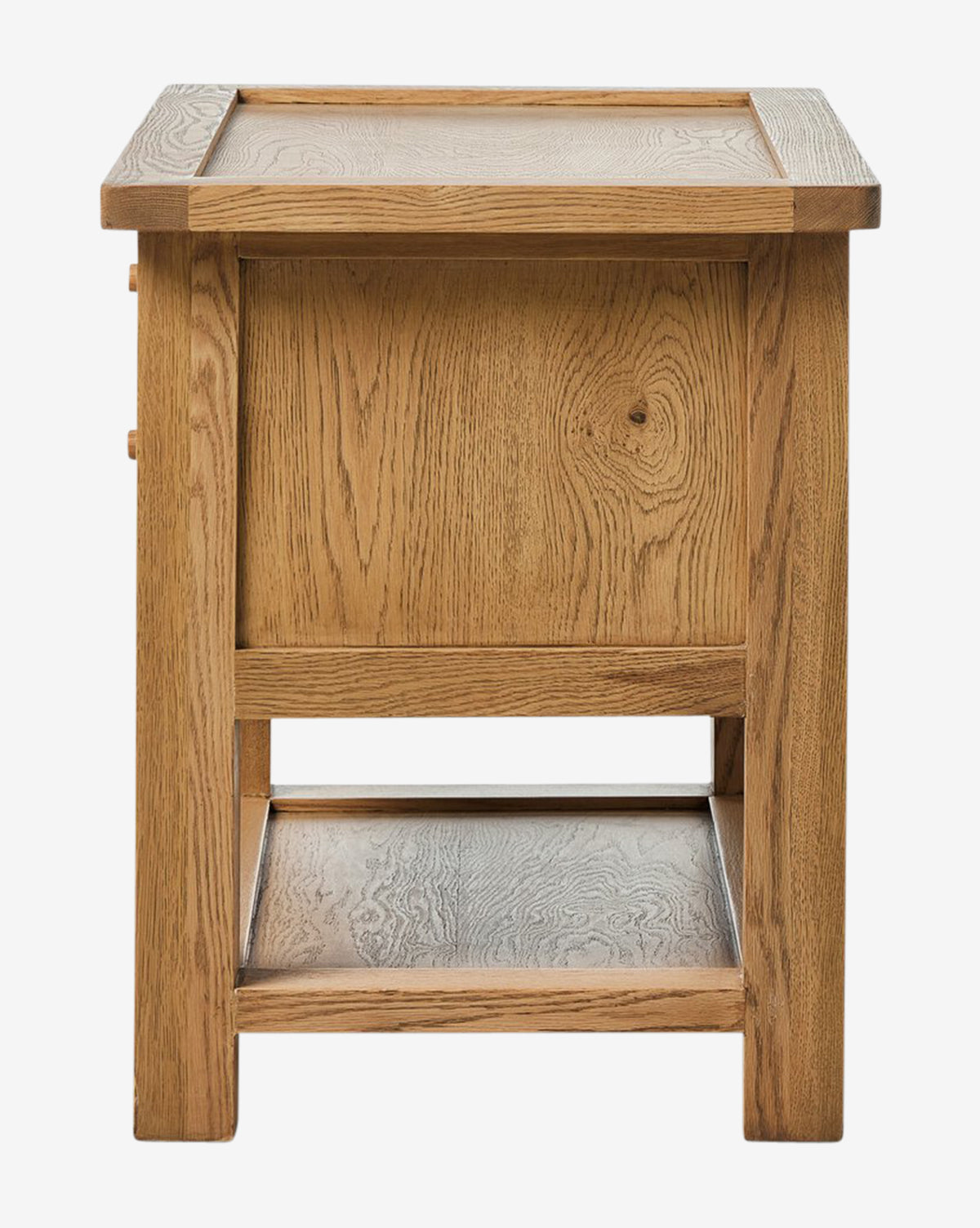 The Faelan Nightstand is a square wooden side table featuring a flat top, sturdy legs, a lower shelf, and a wood panel on one side. Its light oak veneer and visible grain bring warmth and simple style to your bedroom décor, by McGee & Co.