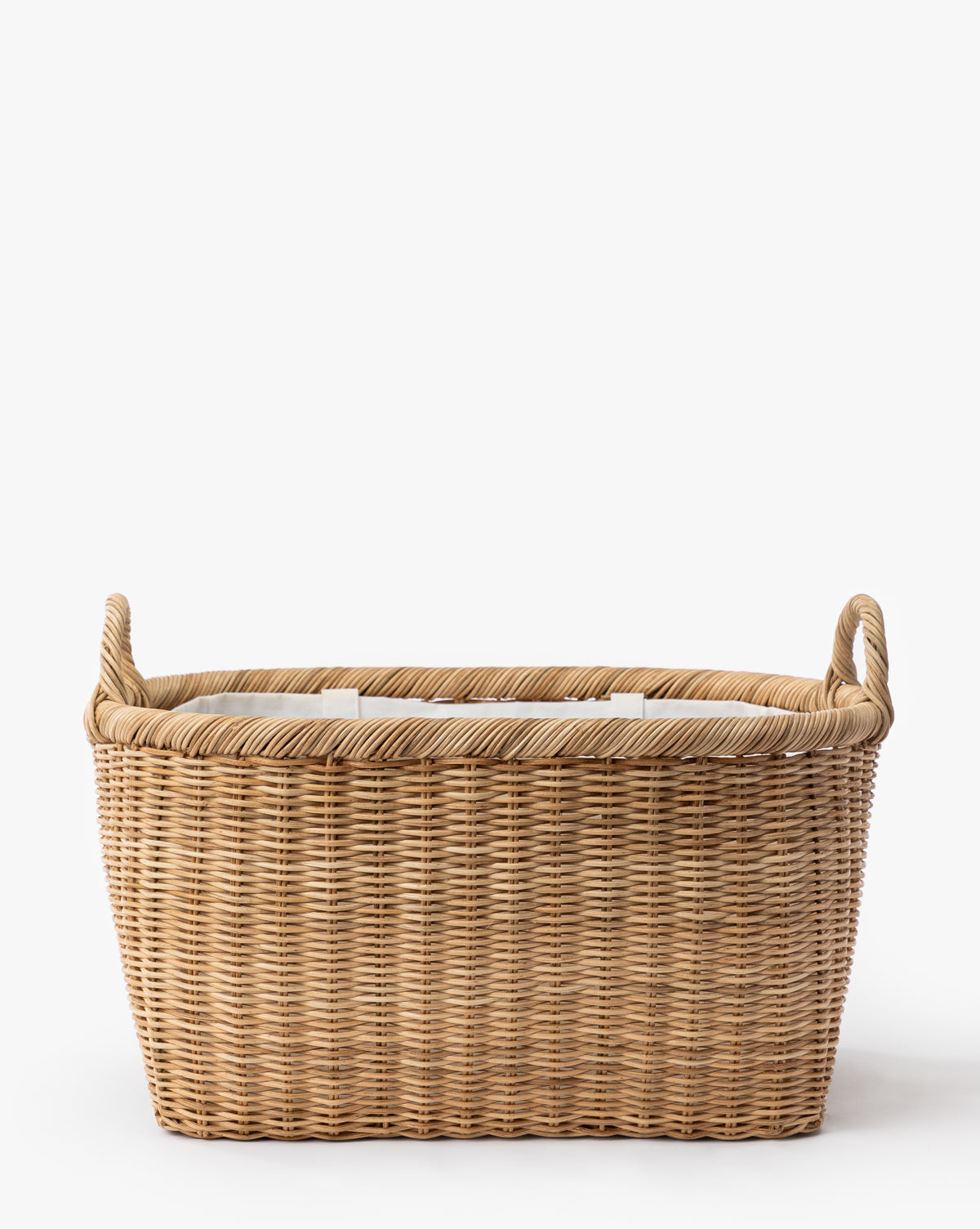 The Fairway Laundry Basket, a rectangular woven basket with two handles and a white canvas lining, is shown against a plain white background by McGee & Co.