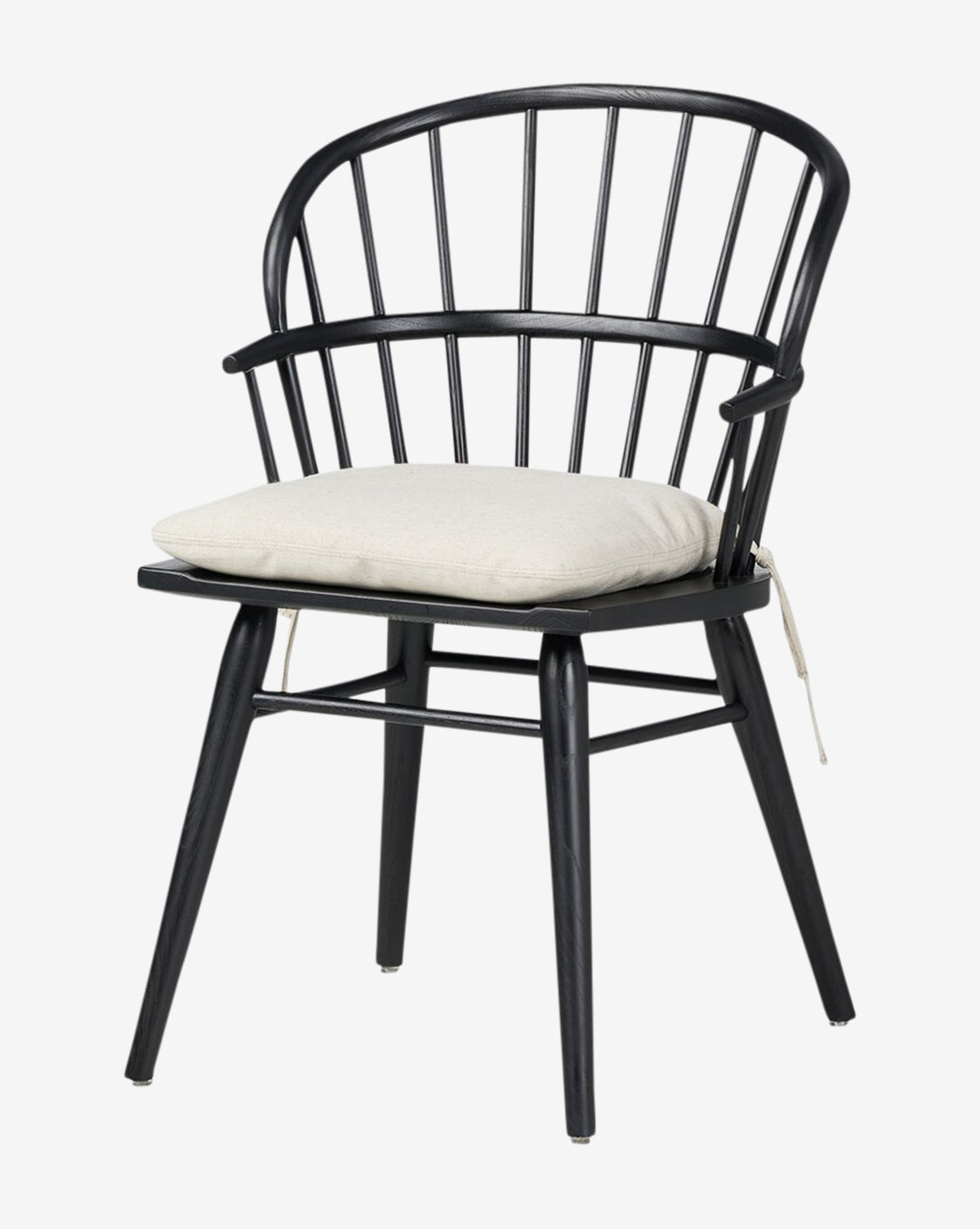The Fiora Dining Chair features a black wooden frame, rounded backrest with vertical slats, and a light beige removable cushion tied to the seat—ideal for enhancing any dining space by McGee & Co.