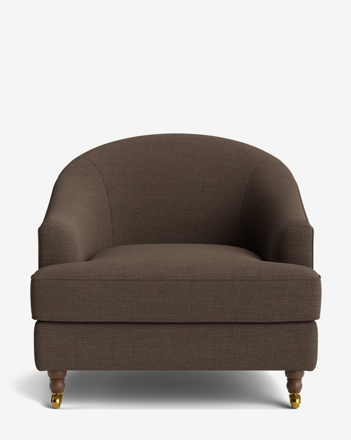 The Fletcher Lounge Chair, shown on a plain white background, offers customizable fabrics, a curved backrest, plush seat cushion, and wooden legs with brass casters, by McGee & Co.