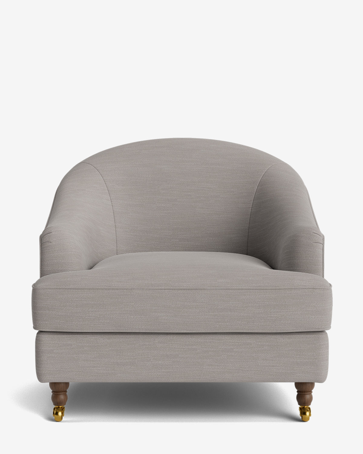 Front view of the Fletcher Lounge Chair, featuring light gray upholstery, a rounded backrest, wide cushioned seat, short wooden legs with brass caster wheels; available in customizable fabrics by McGee & Co.