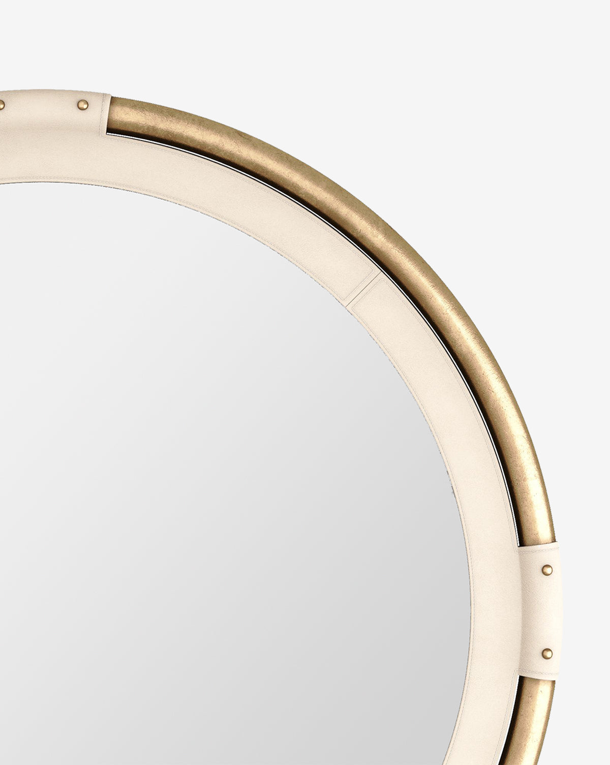 Close-up of the Flora Mirrors upper left section, highlighting its beige leather border and antique brass inner ring, set against a plain white background, by McGee & Co.