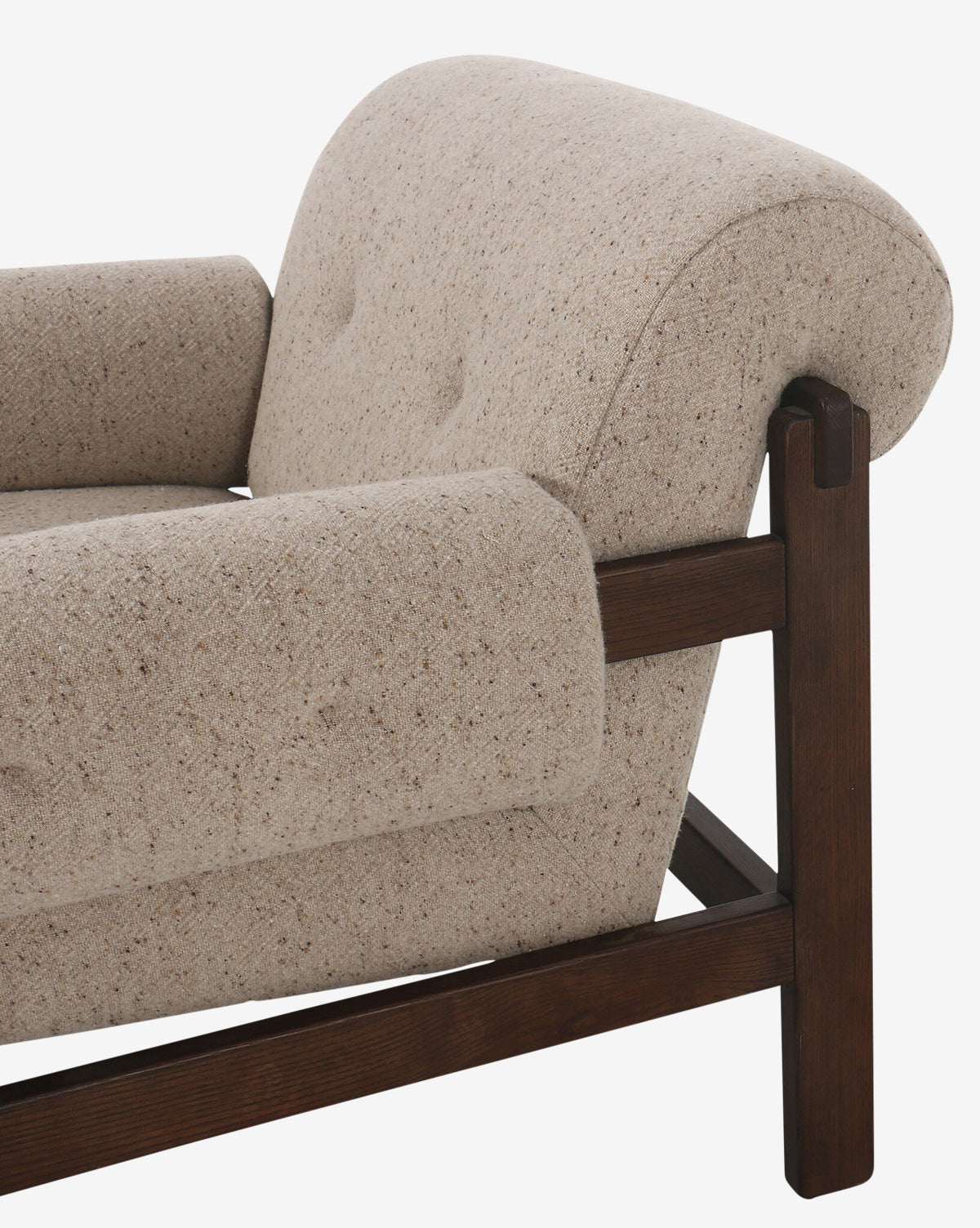 Close-up of the Florent Chair, a modern chair with textured taupe fabric upholstery, dark wood frame, rounded armrests, and a curved backrest by McGee & Co.