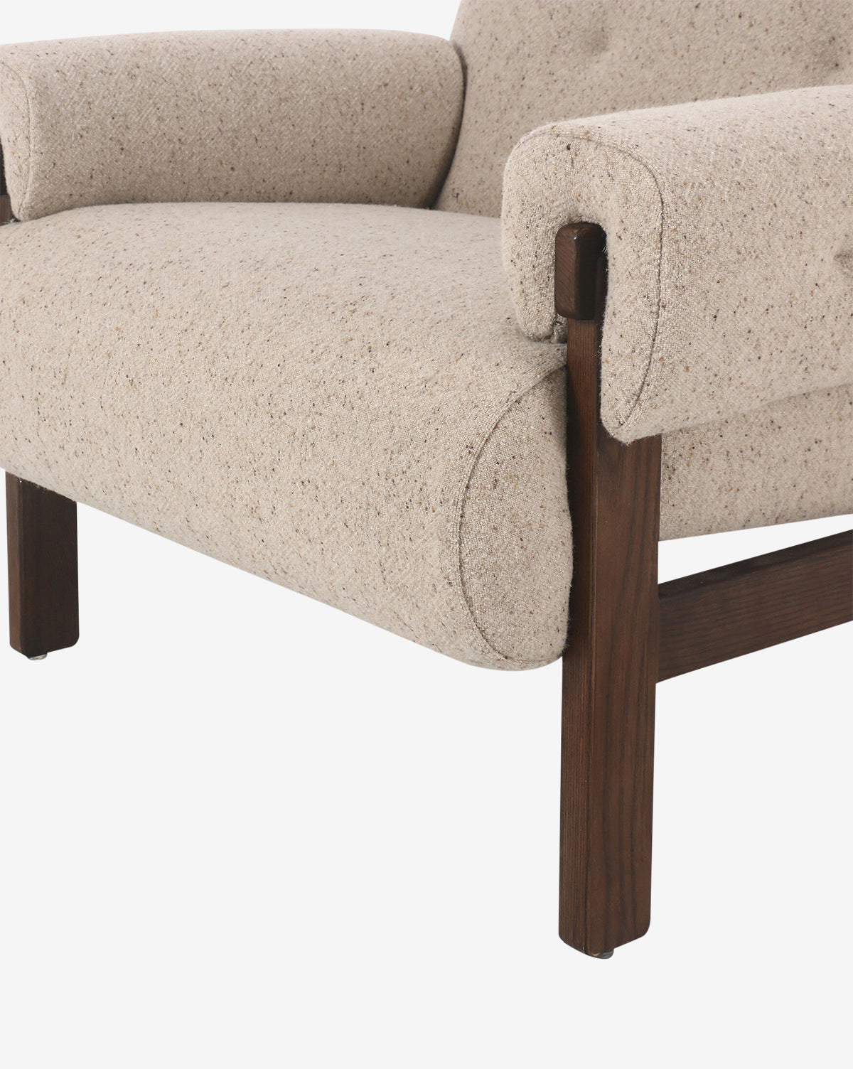 Close-up of the Florent Chair featuring taupe fabric, beige textured upholstery, and dark wooden legs, highlighting the side of the seat, armrest, and part of the backrest, by McGee & Co.