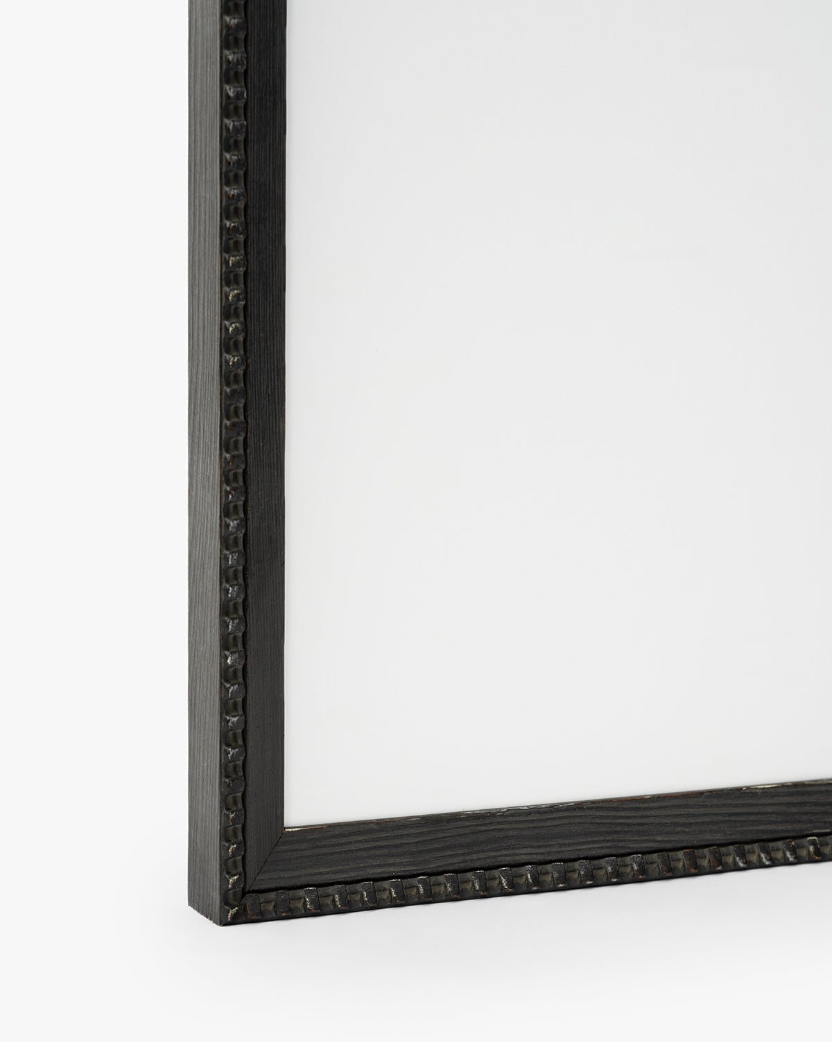 Close-up of a dark, textured rectangular wood frame with a slightly ornate border against a white background. The empty interior is ideal for displaying Flower Vase Still Life by Katie Mulder as a giclee print, by McGee & Co.