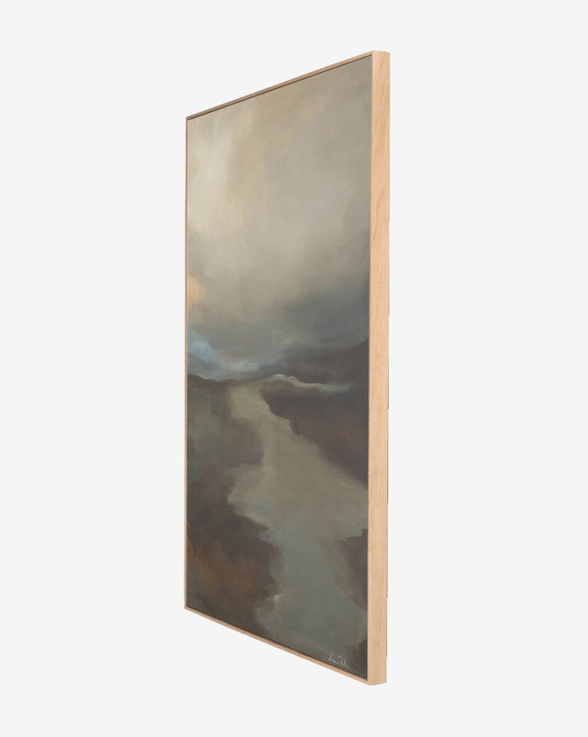 A side view of Fog II by Lauren Fuhr, a vertical framed wall art featuring earthy tones and a cloudy sky above a winding river or path, shown against a white background.