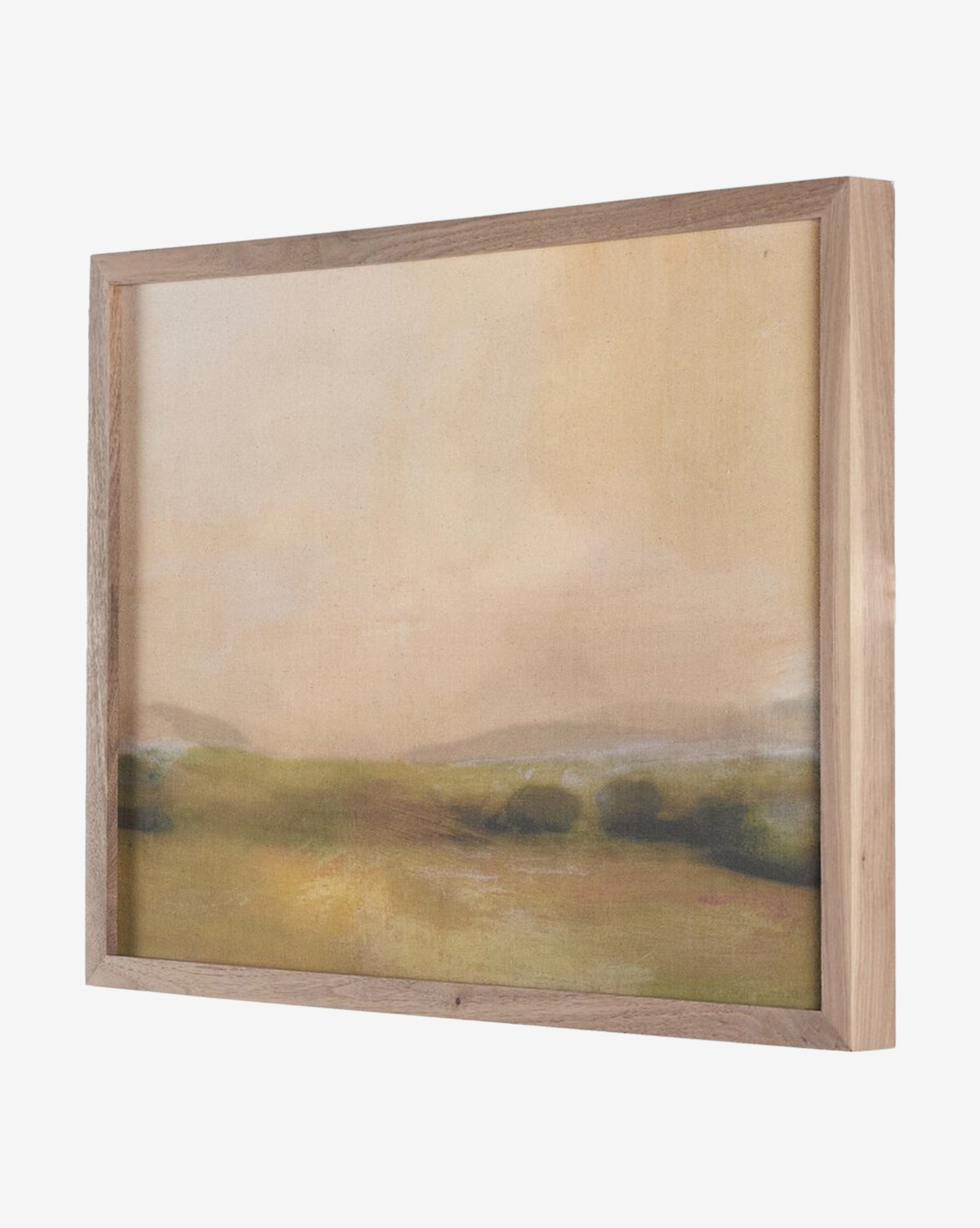 Formation by Dan Hobday is a gallery-quality canvas art print featuring green fields and distant hills beneath a hazy beige sky, framed in light wood.