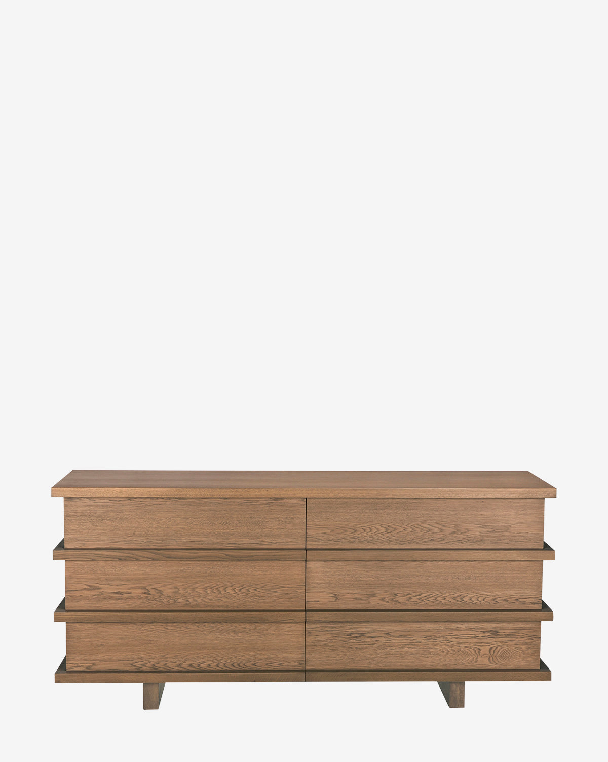 The Frankie Dresser is a modern oak piece with six drawers, a flat top, and two horizontal shelf accents. Its natural medium-brown finish and clean lines make it perfect for contemporary bedrooms and stylish storage needs, by McGee & Co.