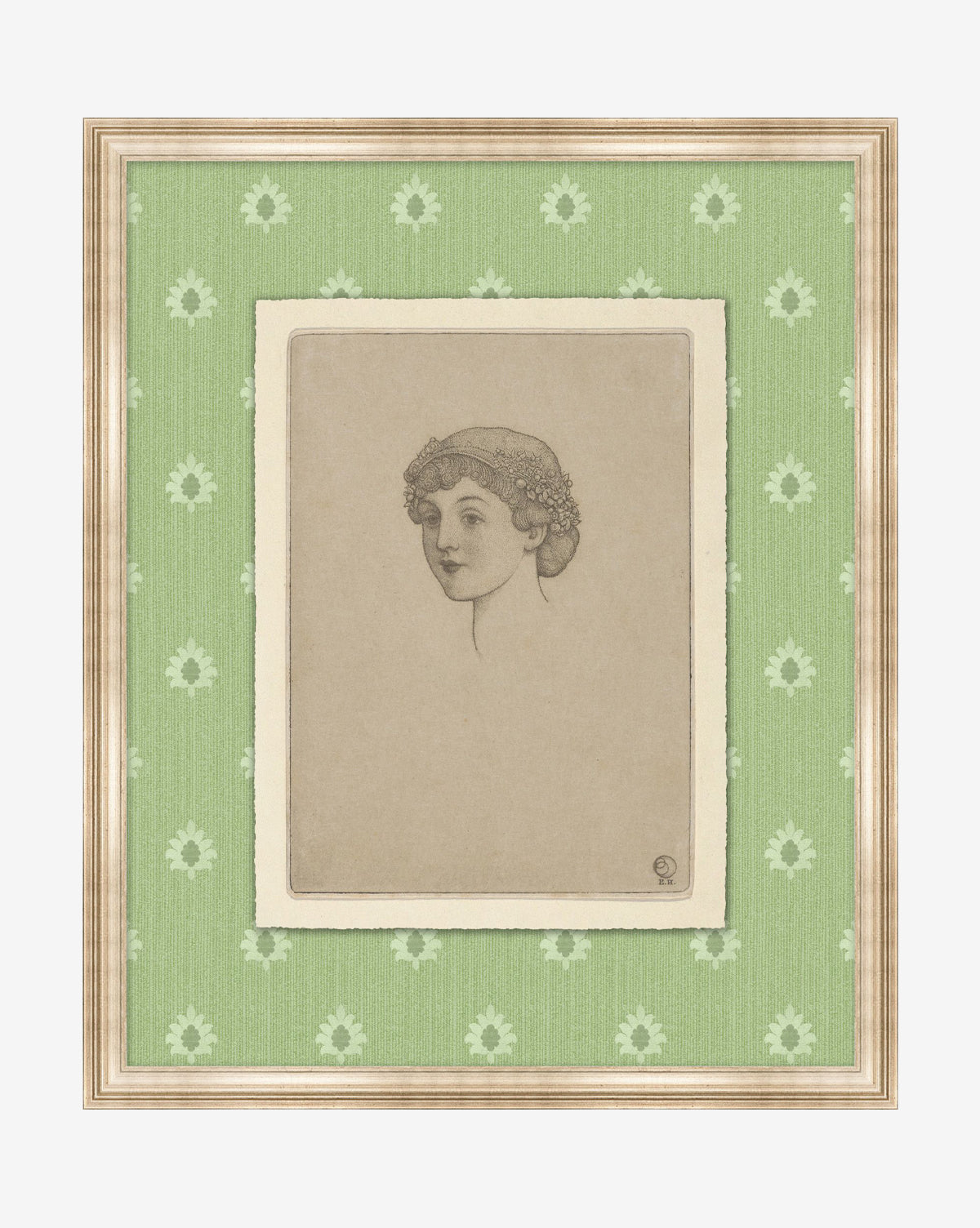 The Garden Party Portrait is a museum-quality giclee print of a woman with short curly hair and a floral headpiece, set against green floral wallpaper, framed in wood with a beige matte border, by McGee & Co.
