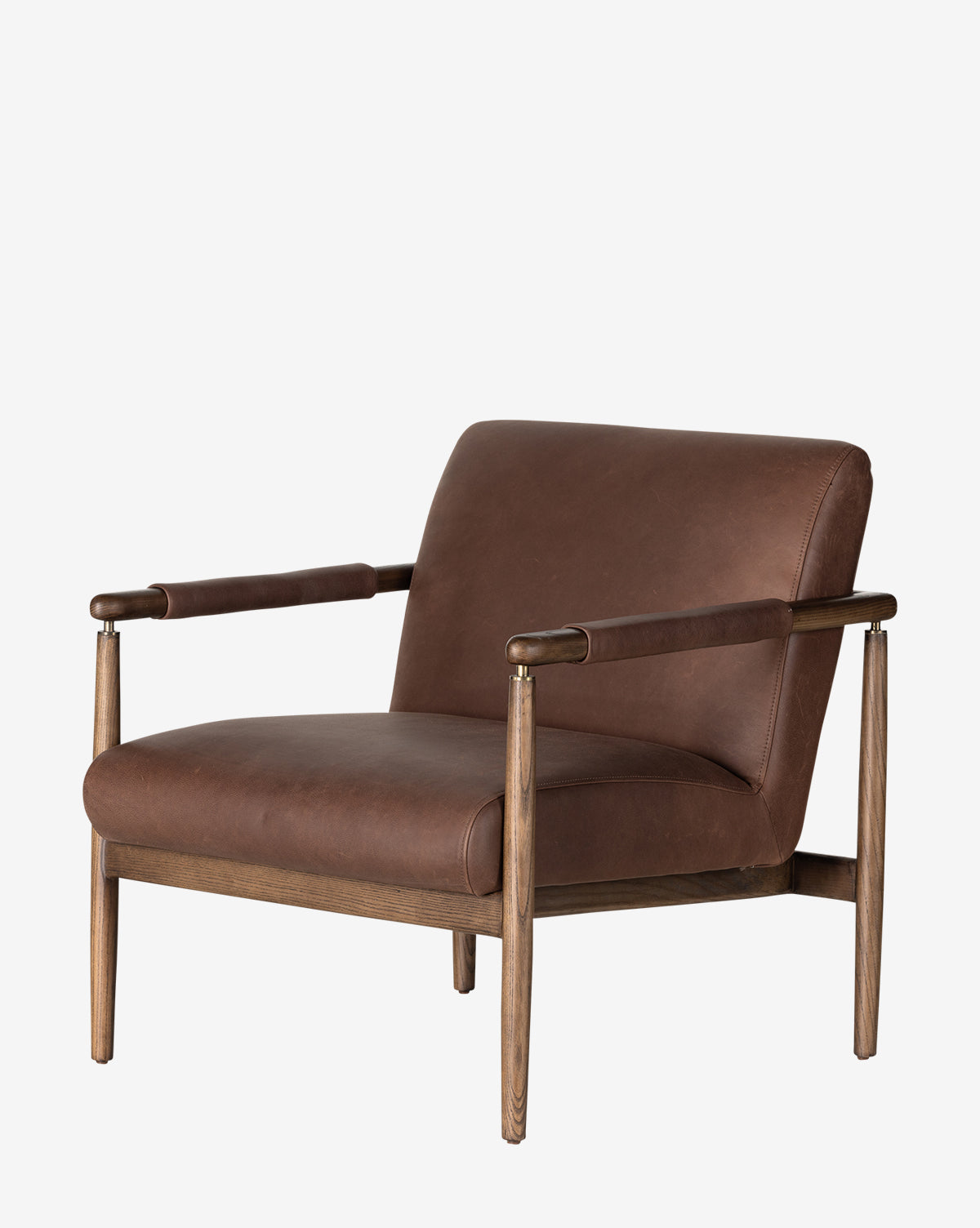 The Gaston Lounge Chair features a brown top grain leather seat and backrest, solid ash frame, padded armrests, and a minimalist mid-century design with clean lines, by McGee & Co.