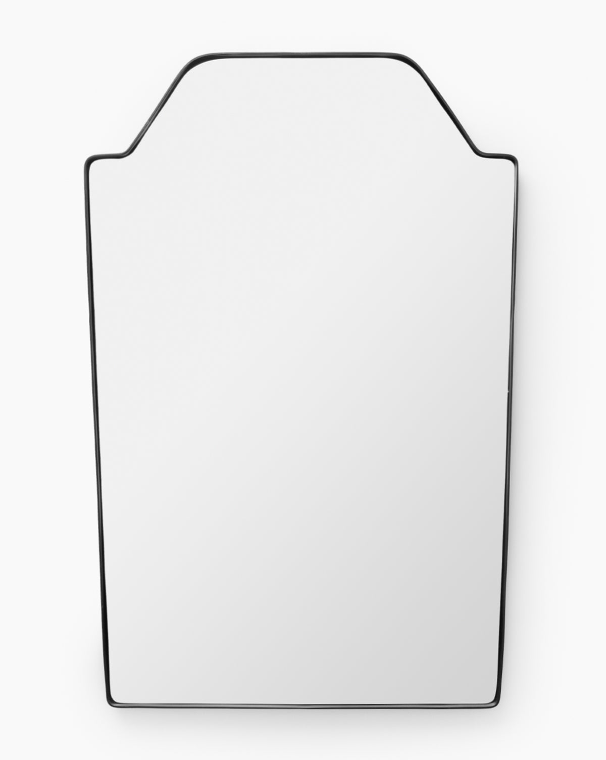 The Giles Wall Mirror is a modern, rectangular mirror with a thin stainless steel border and angled top corners, displayed against a white background, by McGee & Co.