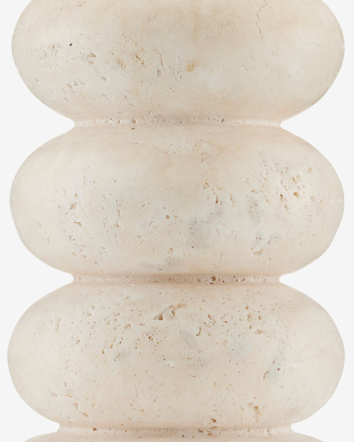 Close-up of the Girault Table Lamp, featuring a beige, textured surface with stacked, rounded shapes and subtle imperfections reminiscent of organic travertine design, by McGee & Co.