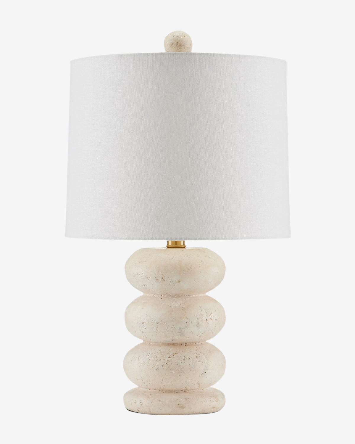 The Girault Table Lamp features a stacked, rounded travertine base with a beige stone texture and a simple white cylindrical shade, finished with a matching finial, by McGee & Co.