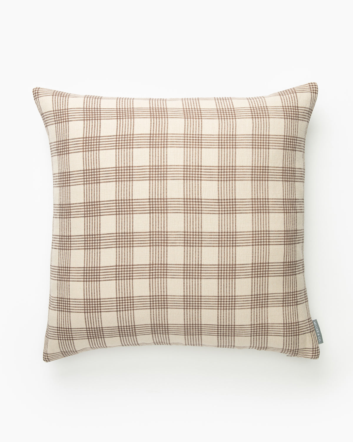 The Glendale Pillow Cover, featuring a beige background and brown plaid pattern in a soft linen-cotton blend, is displayed against a plain white surface by McGee & Co.