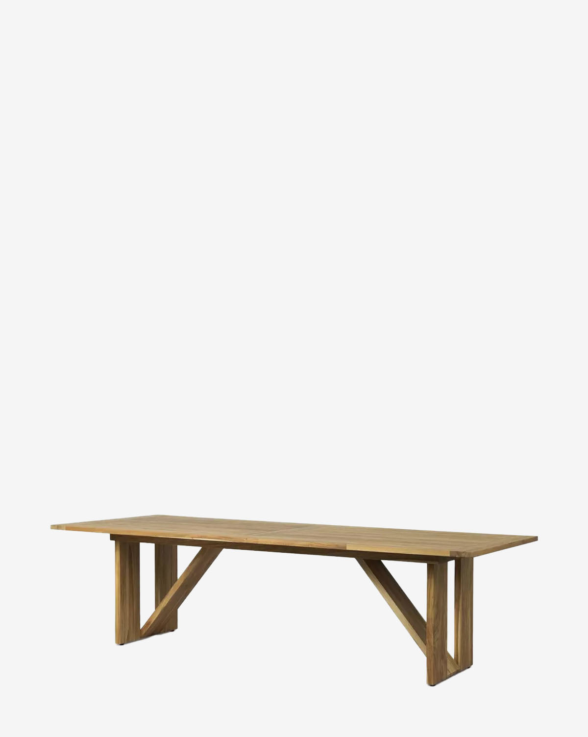 The Glenmore Outdoor Dining Table is a rectangular teak wood table with a minimalist design and angled support beams, perfect for outdoor dining, by McGee & Co. Shown against a plain white background.