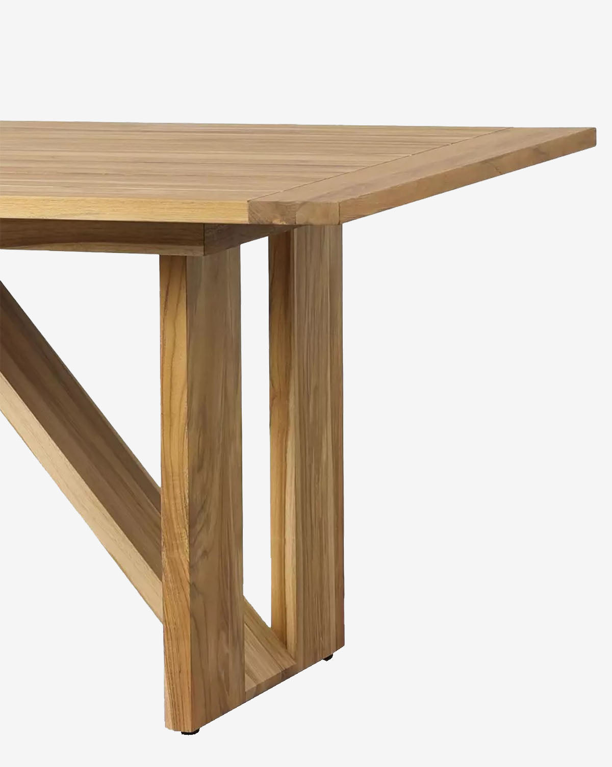 A close-up of the Glenmore Outdoor Dining Table showcases its modern geometric base, clean lines, and natural teak wood finish against a plain white background by McGee & Co.