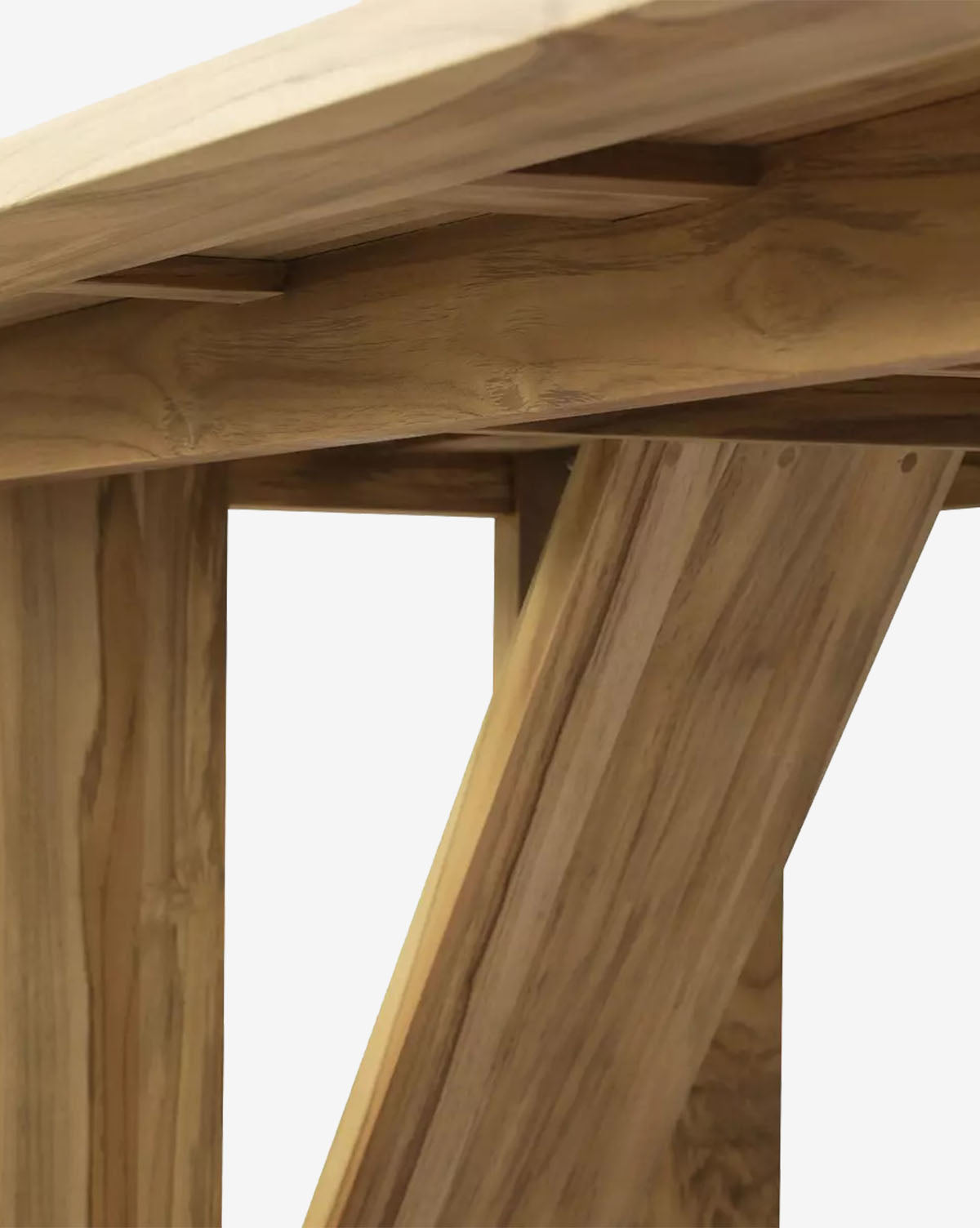 Close-up view of the Glenmore Outdoor Dining Table’s wooden frame and angled support beams, highlighting its natural teak wood grain finish against a plain white background, by McGee & Co.