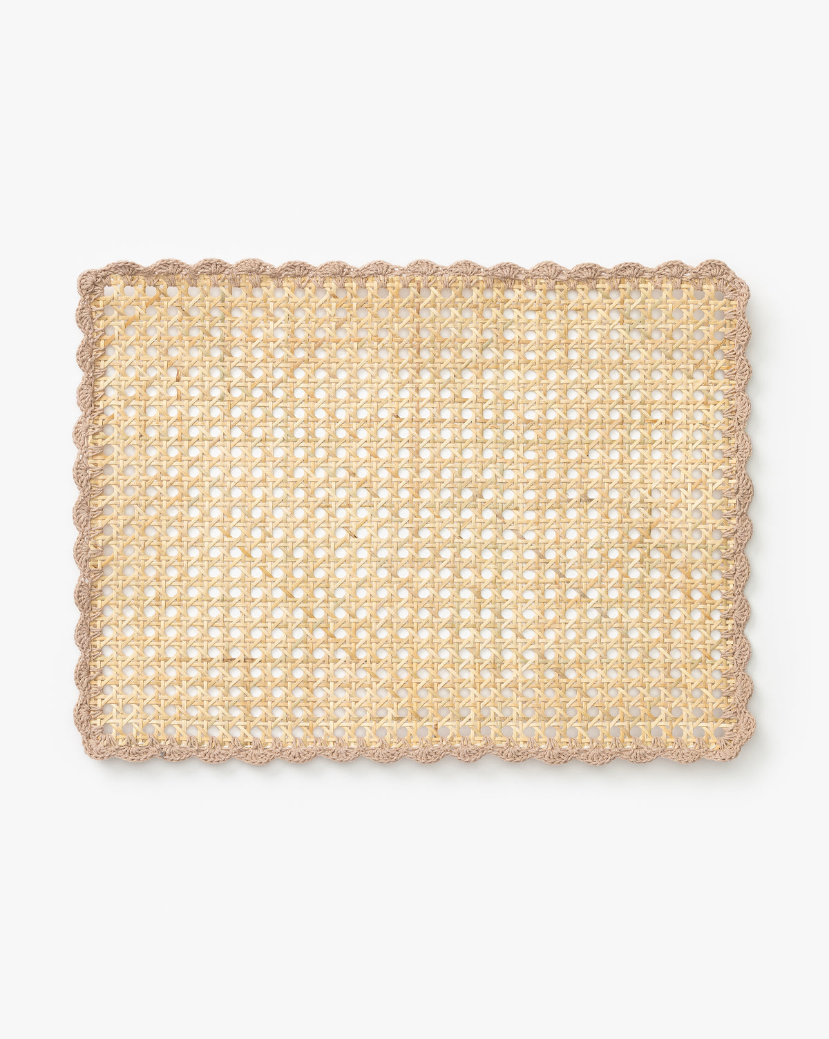 The Gloria Cane Placemat is a rectangular bamboo mat in natural beige with a scalloped light brown border, bringing subtle coastal flair. Shown on a plain white background by McGee & Co.
