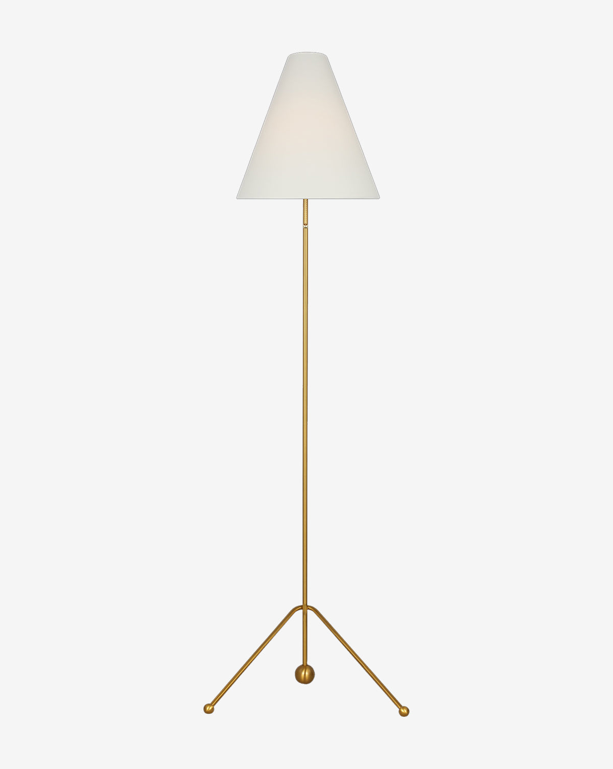 The Gustav Floor Lamp has a slim gold stand with a tripod base and white cone-shaped shade. Its minimalist, elegant design makes this modern lamp a striking addition to any room, by McGee & Co.