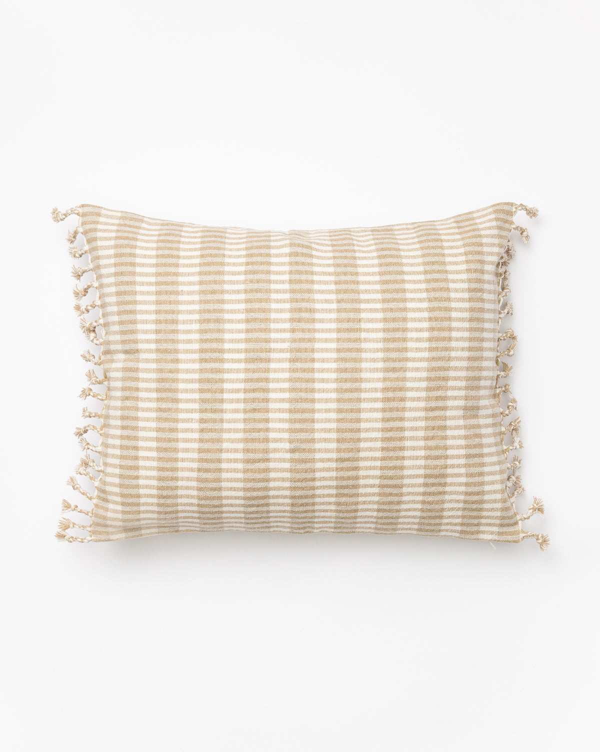 The Gwen Pillow Cover is a rectangular linen-cotton cover with beige and white horizontal stripes, small tassels on the short fringed edges, and a subtle woven texture, shown on a white background, by McGee & Co.