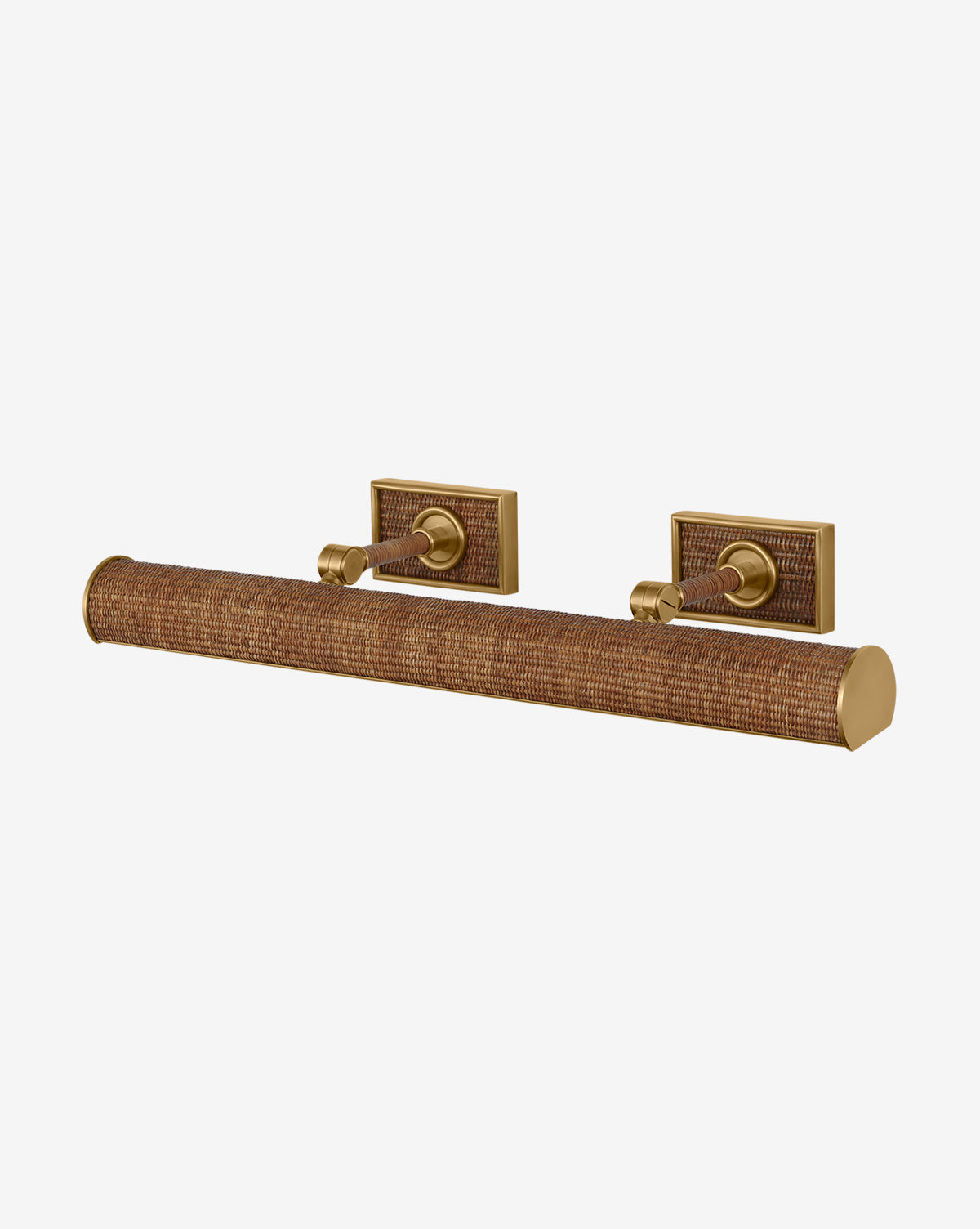 The Halwell Picture Light is a brass wall-mounted fixture with a textured cylindrical shade inspired by woven rattan and two rectangular backplates, ideal for illuminating vintage artwork against a plain white background, by McGee & Co.