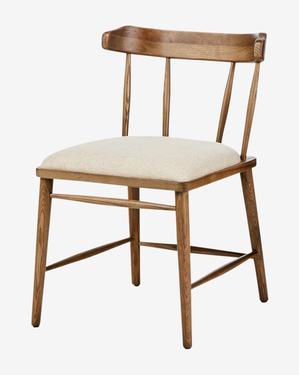 The Harper Dining Chair has a solid ash frame, curved backrest with three spindles, beige upholstered seat, and angled legs with crossbars for support, by McGee & Co.