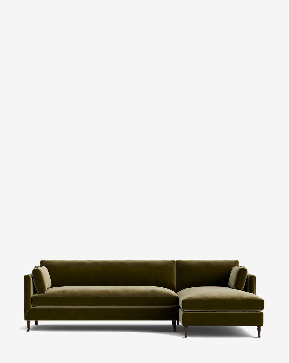 The Haverford Upholstered Right Chaise Sectional 113 is a customizable olive green velvet sofa with wooden legs and gold tips, featuring a right-side chaise and two matching bolster pillows, shown against a plain white background by McGee & Co.