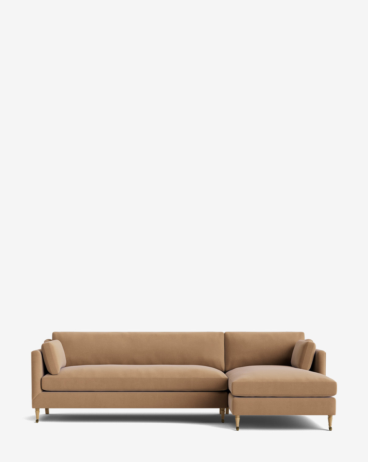 A modern Haverford Upholstered Right Chaise Sectional 113 with slim legs and two matching bolster pillows, this customizable tan sectional is shown against a plain white background, by McGee & Co.