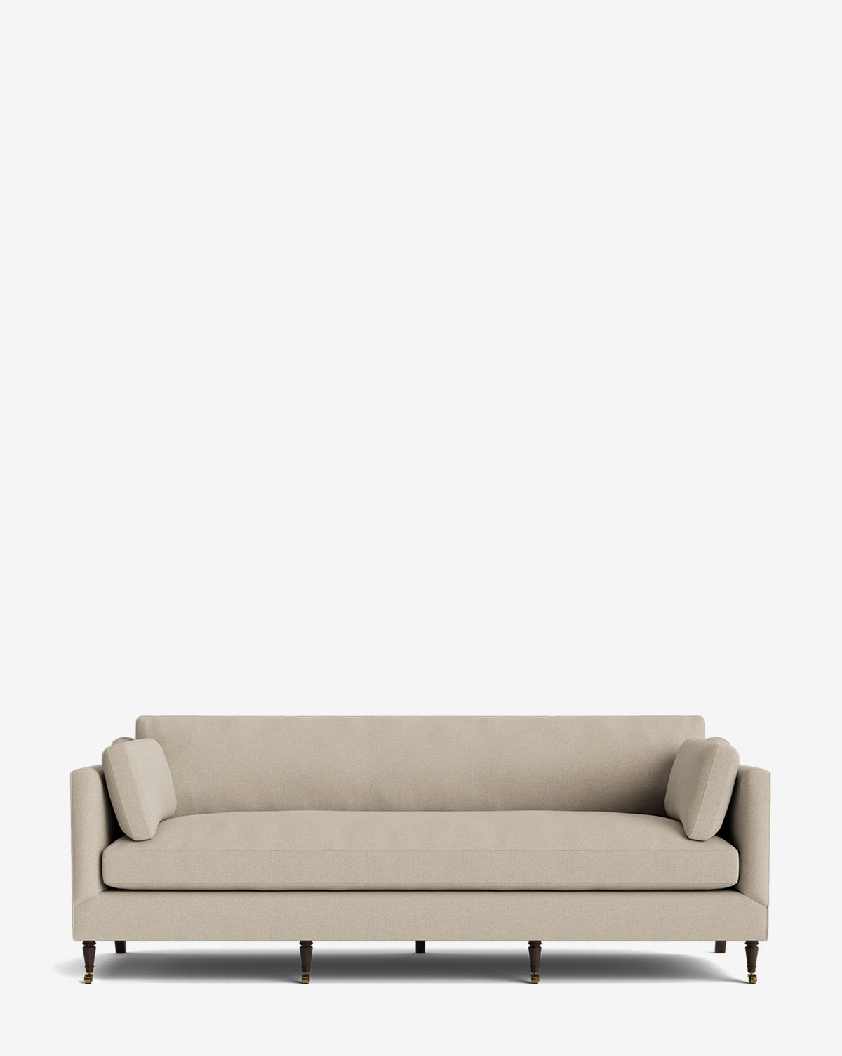 The Haverford Upholstered Sofa 90 is a beige, three-seater with straight arms, two cylindrical cushions, and dark wooden legs with gold casters, showcased against a plain white background by McGee & Co.