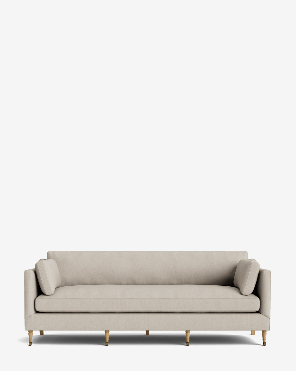 The Haverford Upholstered Sofa 90 features a modern beige design with straight armrests, two cylindrical side pillows, and slender wooden legs with brass accents—blending style and comfort against a plain white background by McGee & Co.