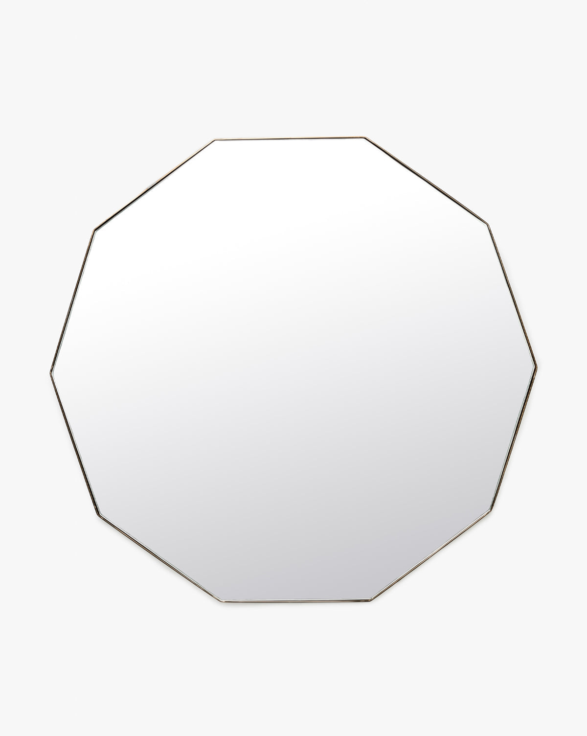 The Hawley Decagon Mirror is a round, frameless wall mirror with a subtle octagonal edge, shown against a plain white background, by McGee & Co.