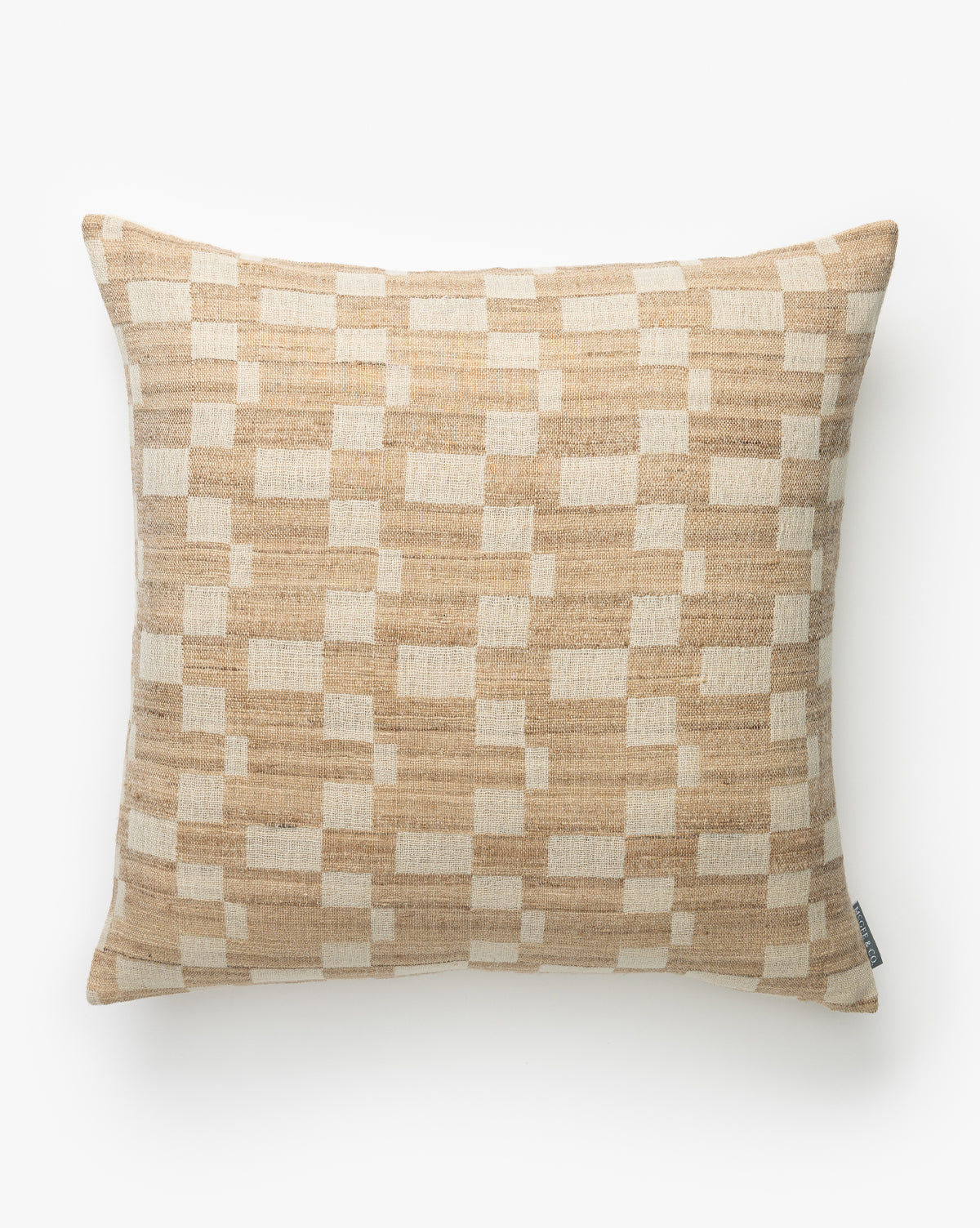 The Hedgerow Pillow Cover features a tan and cream geometric checkered design with interlocking shapes on textured wool, plus a small side tag. The background is plain white, by McGee & Co.