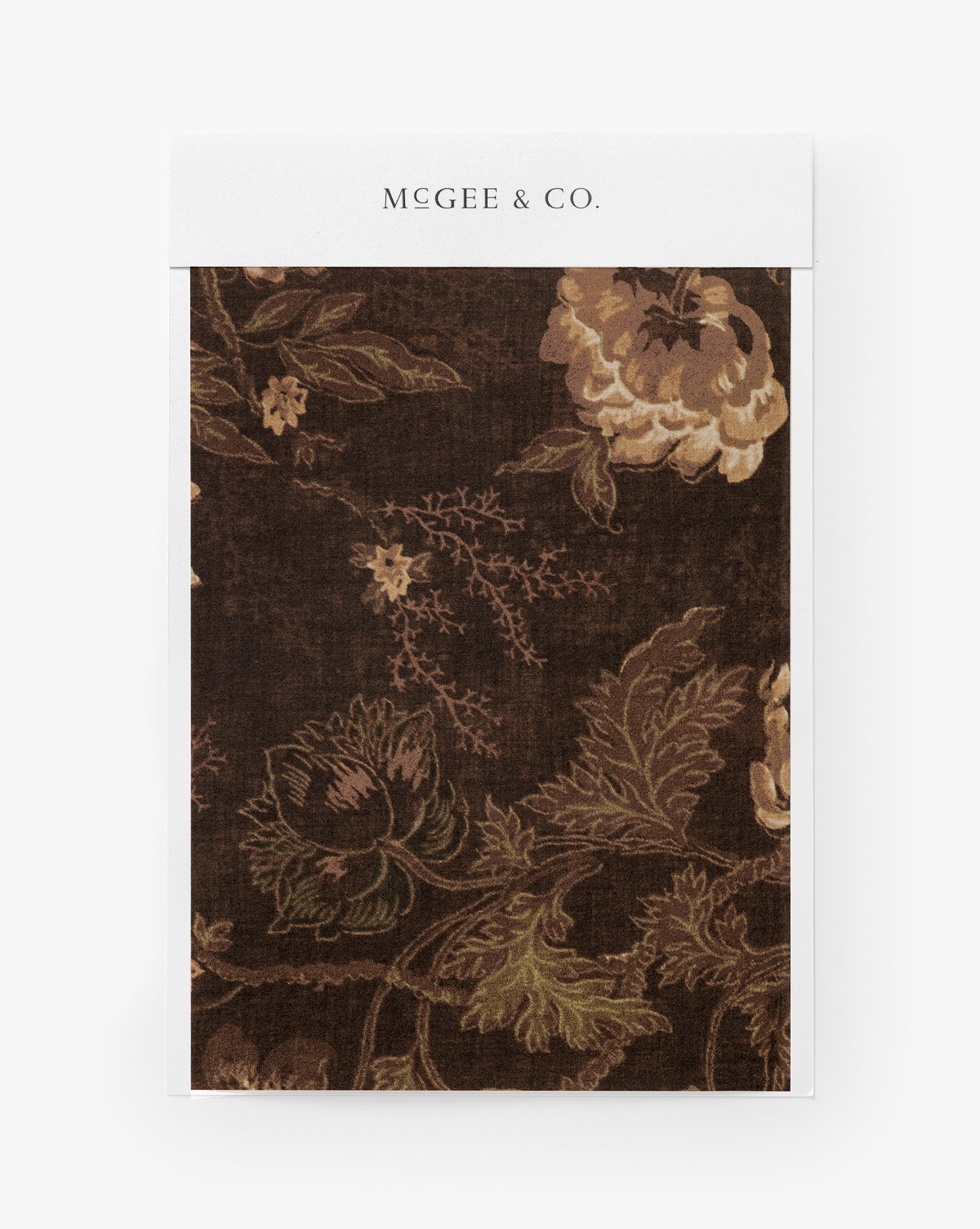 The Hestercombe Floral Wallpaper Swatch features a dark brown background with a painterly floral design in muted beige, green, and tan tones, reminiscent of vintage-inspired wallpaper, by McGee & Co.