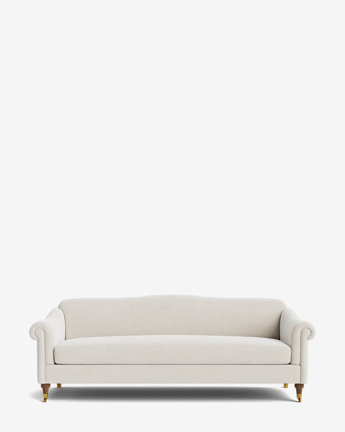 The Hildegard Sofa 90 is a cream-colored, upholstered piece with rolled arms and wooden legs accented by brass casters, shown against a white background. This handcrafted sofa combines timeless elegance with customizable options for your space, by McGee & Co.