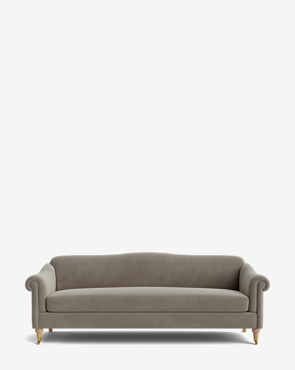 The Hildegard Sofa 90 is a modern, light gray handcrafted piece featuring rolled arms, a gently curved backrest, and wooden legs with small brass castors, shown against a plain white background by McGee & Co.