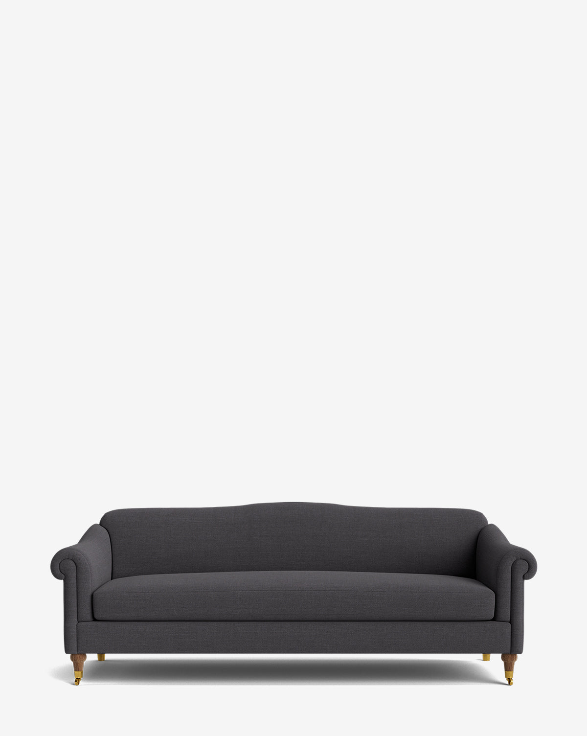 The Hildegard Sofa 90 is a dark gray, handcrafted sofa featuring rolled arms, a gently curved backrest, and wooden legs with brass-colored castors, shown against a plain white background by McGee & Co.