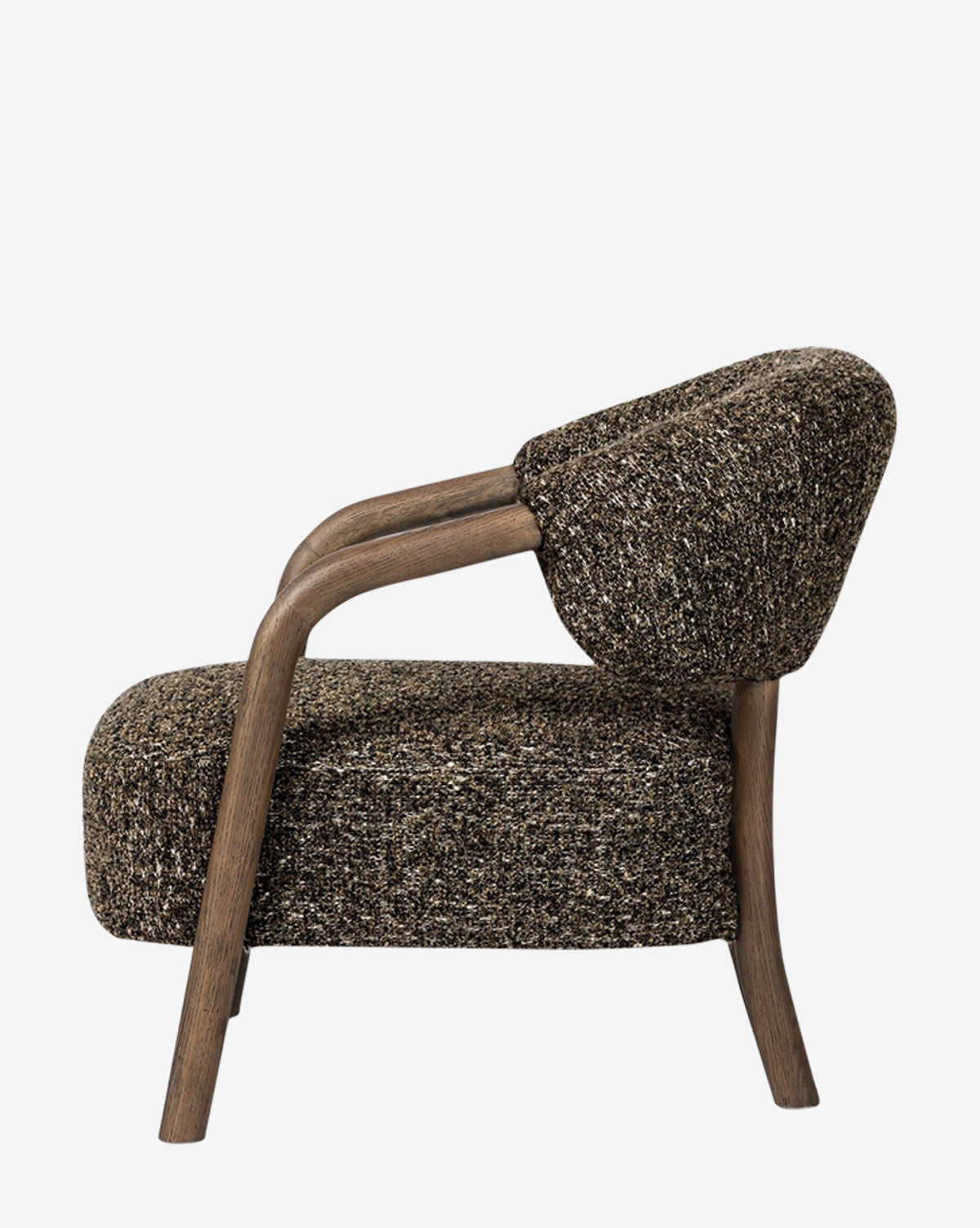Side view of the Holstein Lounge Chair, showcasing its textured brown faux Mongolian shearling upholstery and curved solid oak frame, set against a plain white background, by McGee & Co.