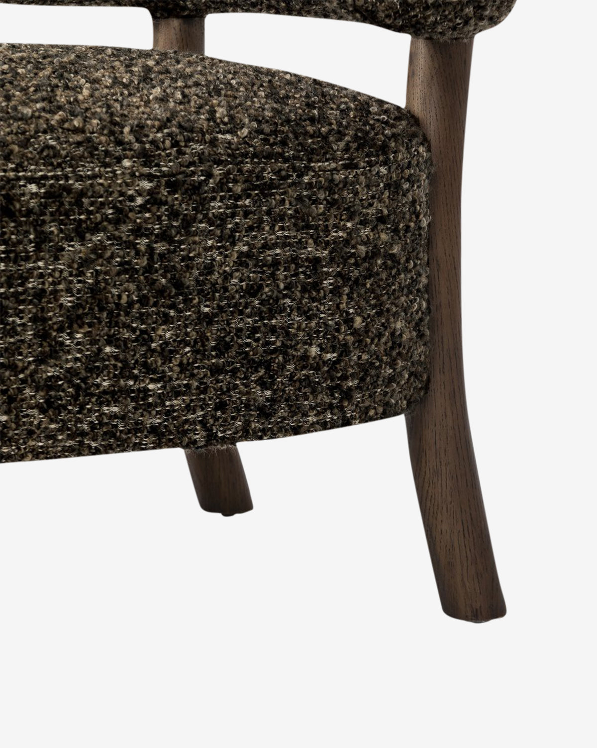 Close-up of the Holstein Lounge Chair with textured dark faux Mongolian shearling upholstery and wooden legs, set against a white background, by McGee & Co.
