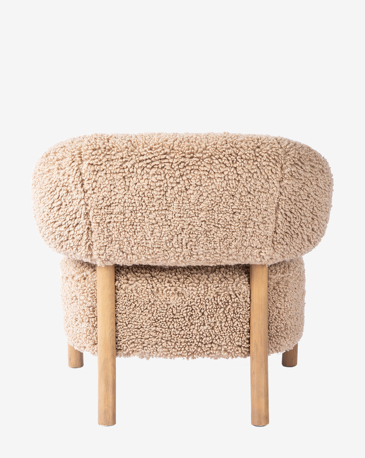 The Holstein Lounge Chair features cozy tan faux Mongolian shearling upholstery, rounded edges, and four light wood legs, shown from the back against a white background by McGee & Co.