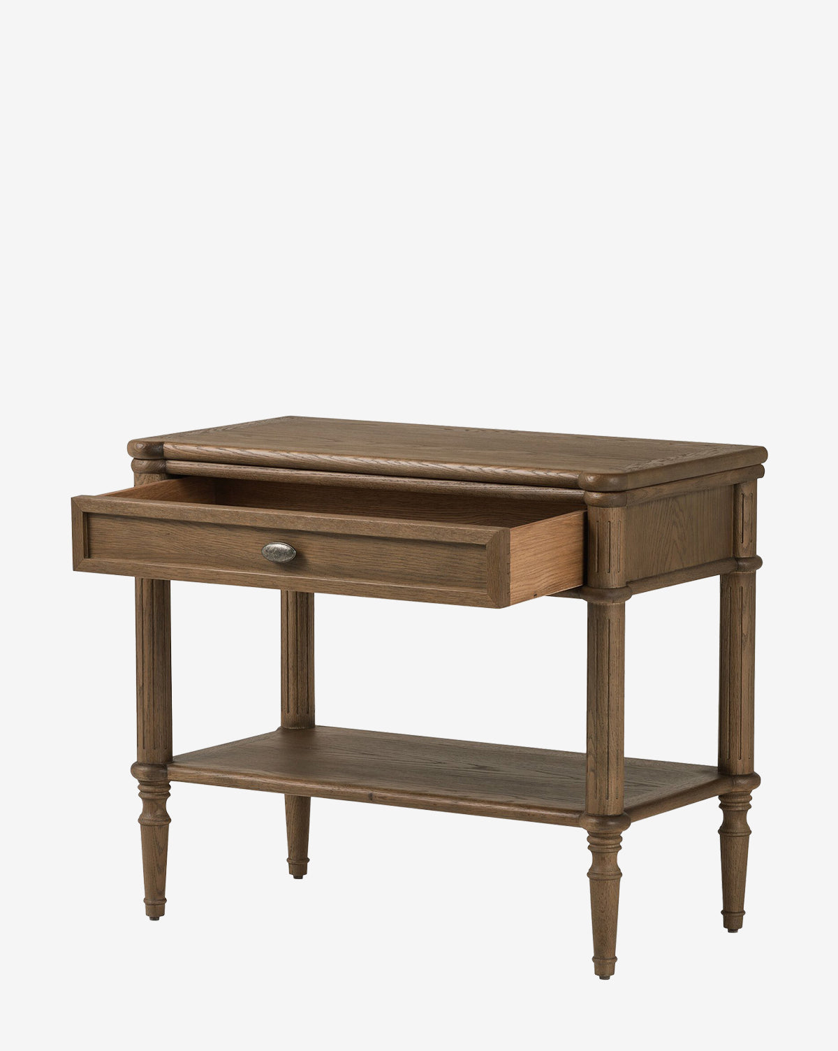 The Humphrey Nightstand, crafted from oak with turned legs, a lower shelf, and a single partially open drawer, is shown against a plain white background—an elegant option for traditional bedroom décor, by McGee & Co.