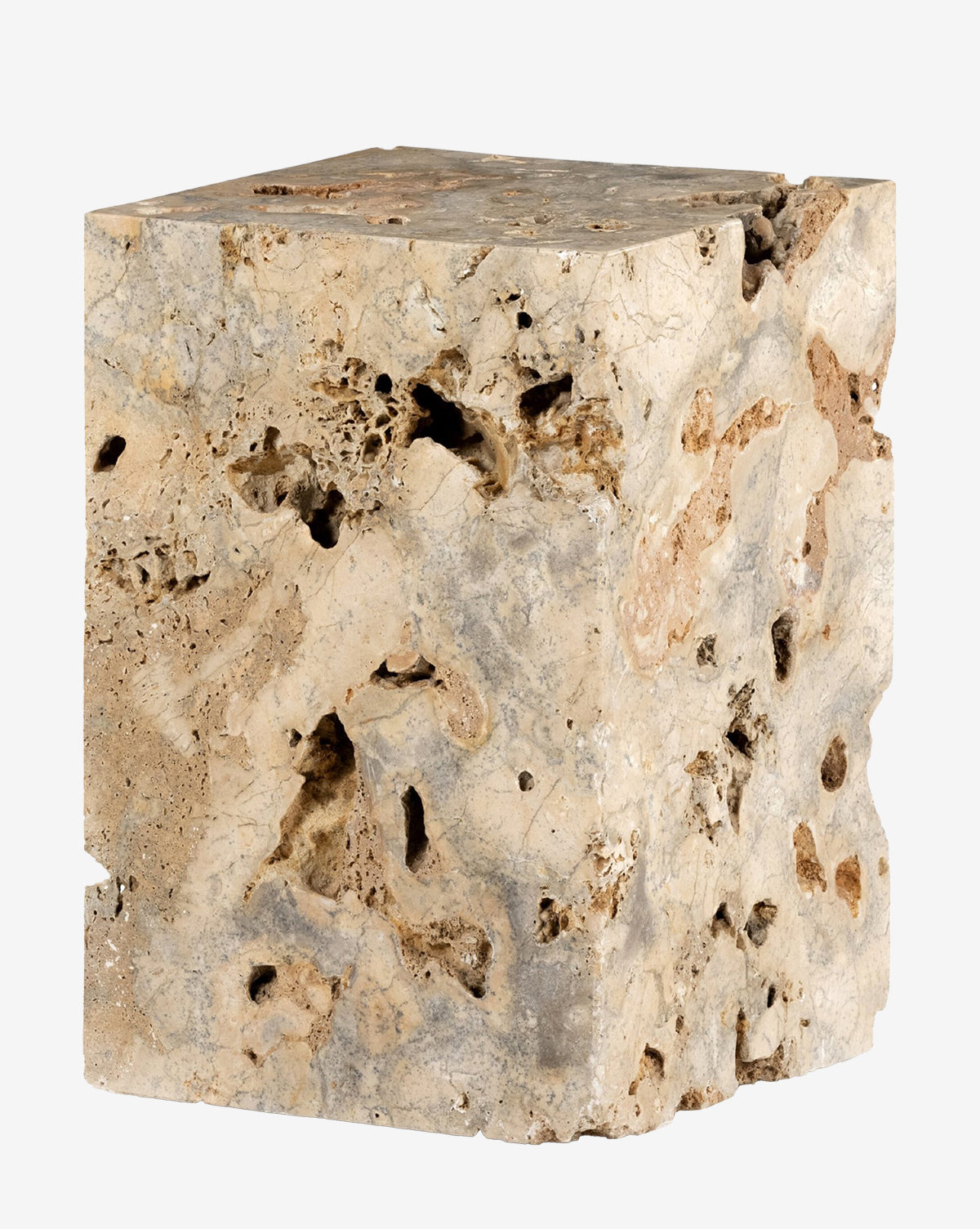 The Ima End Table is a rectangular block of porous beige stone with rough, uneven surfaces and natural holes, making it a unique addition to your living room, by McGee & Co.