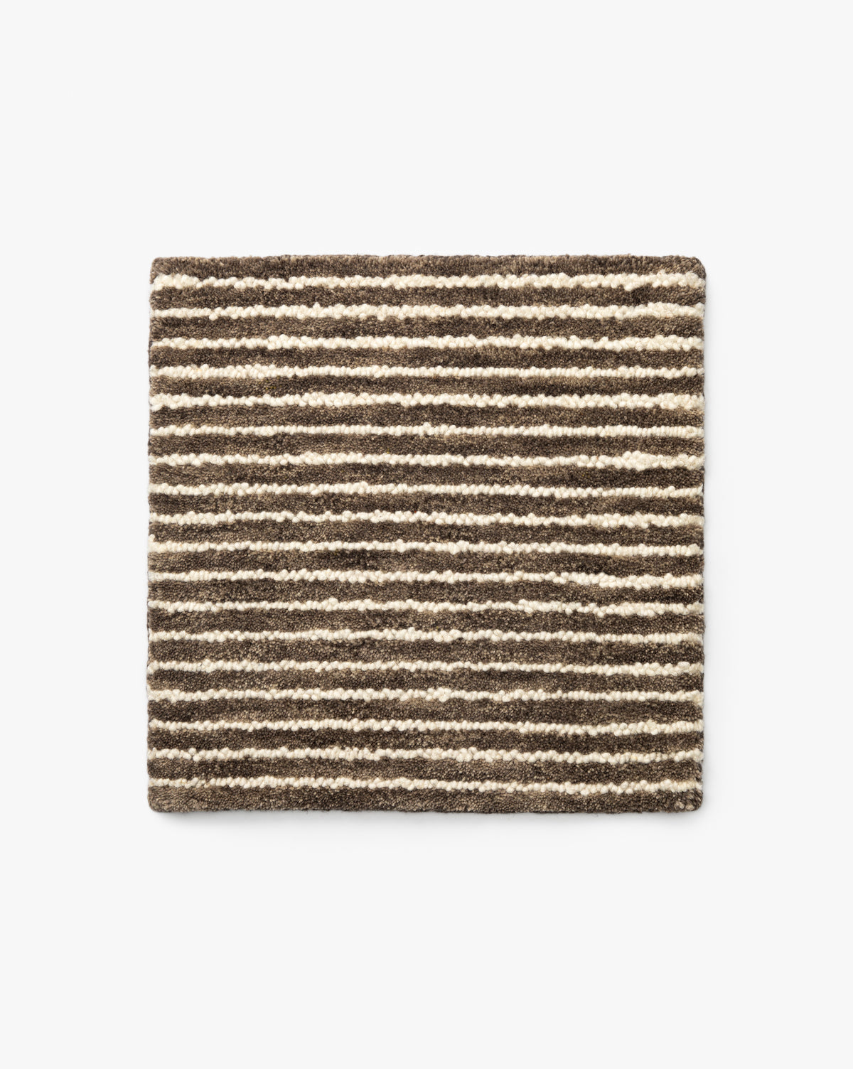 The Inara Mocha Hand-Tufted Wool Rug Swatch is a square sample with a textured surface and horizontal stripes in varying brown and beige tones on a white background, by McGee & Co.