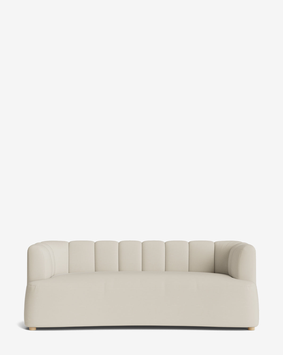 The Ines Sofa 90 is a modern, light beige velvet sofa with rounded edges and a low, vertically tufted backrest, shown against a plain white background by McGee & Co.