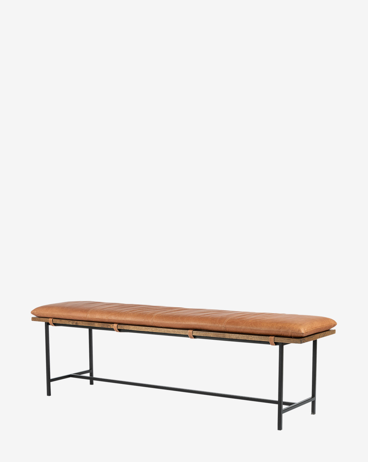The Jagger Accent Bench features a minimalist design with a tan leather cushion and black metal legs, seamlessly blending into any space—ideal for transitional styles. Shown against a plain white background by McGee & Co.