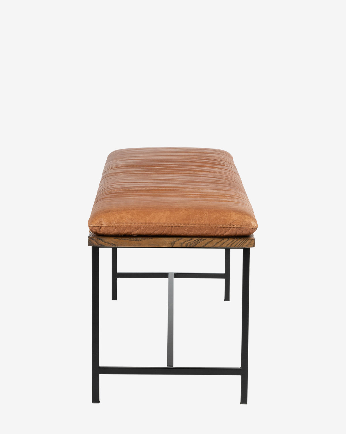 The Jagger Accent Bench features a brown leather cushioned seat and black metal legs, shown from the front against a white background—perfect for bringing transitional style to your space, by McGee & Co.